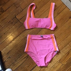 Pink scoop neck bikini with high-waisted bottoms.